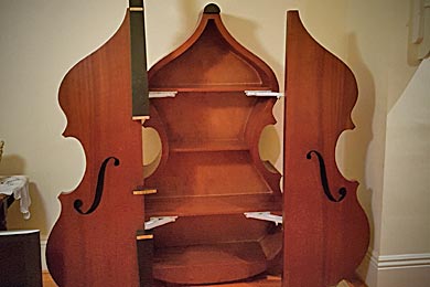 wooden cabinet looks like bass musical instrument open